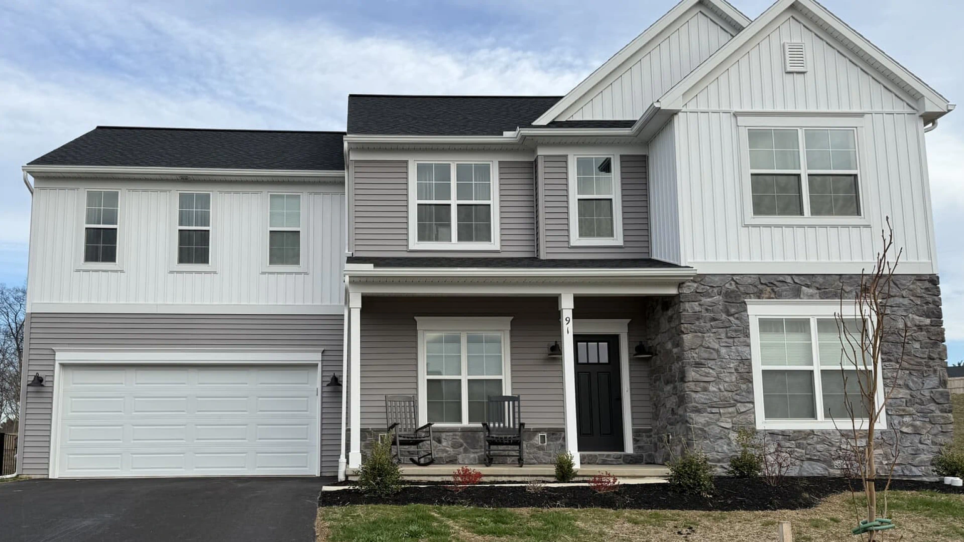 house with grey roofing hero